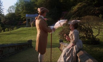 Movie still from “Barry Lyndon” (1975), directed by Stanley Kubrick – A man and a woman dressed in period clothing; Wide shot, High angle