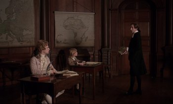 Movie still from “Barry Lyndon” (1975), directed by Stanley Kubrick – Three people sitting at a desk in front of a map; Wide shot, High angle