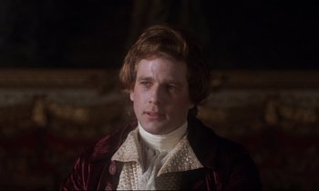 Movie still from “Barry Lyndon” (1975), directed by Stanley Kubrick – A man in a red jacket and a white shirt; Close Up shot, Over the shoulder angle