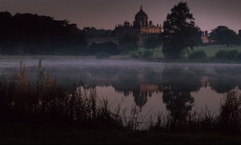 Movie still from “Barry Lyndon” (1975), directed by Stanley Kubrick – A lake in front of a large building at night time; Extreme Wide shot, High angle