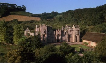 Movie still from “Barry Lyndon” (1975), directed by Stanley Kubrick – An old castle is shown on a hillside; Extreme Wide shot, High angle