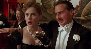 Movie still from “Barton Fink” (1991), directed by Joel Coen – A man and a woman holding a glass of wine; Close Up shot, Low angle