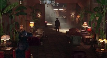 Movie still from “Barton Fink” (1991), directed by Joel Coen – A woman is walking through a hallway in a hotel; Wide shot, High angle