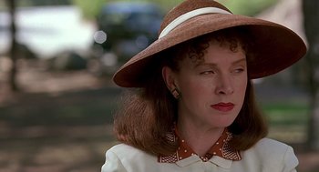 Movie still from “Barton Fink” (1991), directed by Joel Coen – A person wearing a hat; Close Up shot, Over the shoulder angle