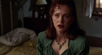 Movie still from “Barton Fink” (1991), directed by Joel Coen – A person wearing a green shirt; Close Up shot, Over the shoulder angle