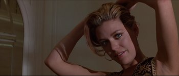 Movie still from “Basic Instinct” (1992), directed by Paul Verhoeven – A woman's face with her hand in her hair; Close Up shot, Low angle