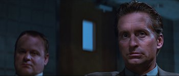 Movie still from “Basic Instinct” (1992), directed by Paul Verhoeven – A person in a room; Close Up shot, Low angle