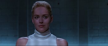Movie still from “Basic Instinct” (1992), directed by Paul Verhoeven – A person wearing a white shirt; Close Up shot, Low angle