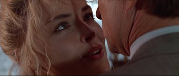 Movie still from “Basic Instinct” (1992), directed by Paul Verhoeven – A woman's face and a man's face; Close Up shot, Over the shoulder angle