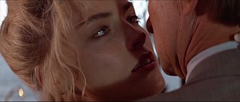 Movie still from “Basic Instinct” (1992), directed by Paul Verhoeven – A woman's face and a man's face; Extreme Close Up shot, Overhead angle