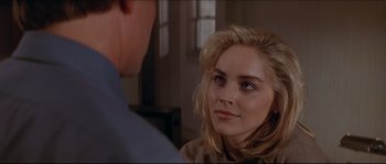 Movie still from “Basic Instinct” (1992), directed by Paul Verhoeven – A person looking at another person; Close Up shot, Over the shoulder angle