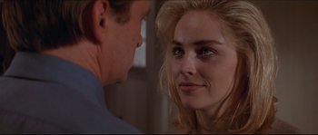 Movie still from “Basic Instinct” (1992), directed by Paul Verhoeven – A man and a woman looking at one another; Close Up shot, Over the shoulder angle