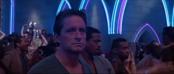 Movie still from “Basic Instinct” (1992), directed by Paul Verhoeven – A group of men standing next to each other in a room; Close Up shot, Low angle