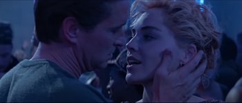 Movie still from “Basic Instinct” (1992), directed by Paul Verhoeven – A man and a woman face to face in the dark; Close Up shot, Over the shoulder angle