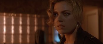 Movie still from “Basic Instinct” (1992), directed by Paul Verhoeven – A person wearing a black shirt; Close Up shot, Over the shoulder angle