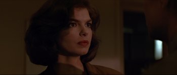 Movie still from “Basic Instinct” (1992), directed by Paul Verhoeven – A person wearing a brown jacket; Close Up shot, Over the shoulder angle