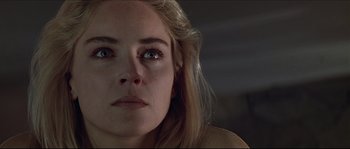Movie still from “Basic Instinct” (1992), directed by Paul Verhoeven – A woman's eyes and face; Close Up shot, Low angle