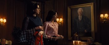 Movie still from “Battle of the Sexes” (2017), directed by Valerie Faris – Two women standing in front of a mirror holding nintendo wii game controllers; Medium shot, Low angle