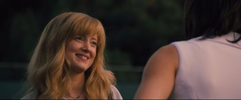 Movie still from “Battle of the Sexes” (2017), directed by Valerie Faris – A person with long blonde hair; Close Up shot, Over the shoulder angle