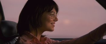 Movie still from “Battle of the Sexes” (2017), directed by Valerie Faris – A person wearing glasses; Close Up shot, Over the shoulder angle