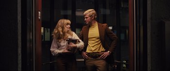 Movie still from “Battle of the Sexes” (2017), directed by Valerie Faris – A man and a woman dressed up like a man and woman; Medium shot, Low angle