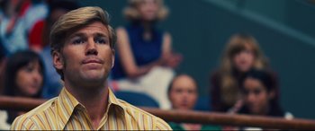 Movie still from “Battle of the Sexes” (2017), directed by Valerie Faris – A group of people sitting in a room; Close Up shot, Low angle