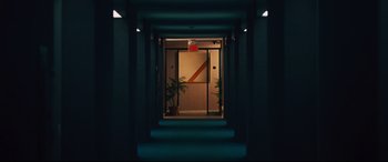 Movie still from “Battle of the Sexes” (2017), directed by Valerie Faris – An elevator with a red and white sign on the side of it; Extreme Wide shot, High angle