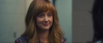 Movie still from “Battle of the Sexes” (2017), directed by Valerie Faris – A person with long red hair; Close Up shot, Over the shoulder angle