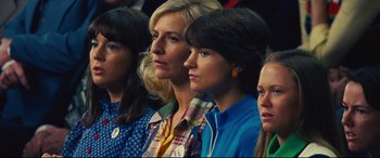 Movie still from “Battle of the Sexes” (2017), directed by Valerie Faris – A group of women sitting next to each other in a room; Close Up shot, High angle