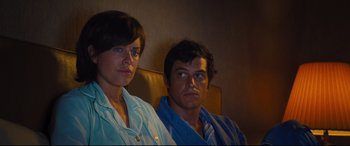 Movie still from “Battle of the Sexes” (2017), directed by Valerie Faris – A man and a woman sitting next to each other; Medium shot, Over the shoulder angle