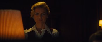 Movie still from “Battle of the Sexes” (2017), directed by Valerie Faris – A woman with blonde hair wearing a white shirt and a vest; Close Up shot, Low angle