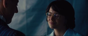 Movie still from “Battle of the Sexes” (2017), directed by Valerie Faris – A person wearing glasses and a white collared shirt; Close Up shot, Over the shoulder angle