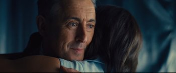 Movie still from “Battle of the Sexes” (2017), directed by Valerie Faris – An older man is hugging a younger woman; Close Up shot, Over the shoulder angle