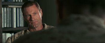 Movie still from “Battle Los Angeles” (2011), directed by Jonathan Liebesman – A person looking at the camera; Close Up shot, Over the shoulder angle