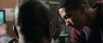 Movie still from “Battle Los Angeles” (2011), directed by Jonathan Liebesman – Two men are talking to each other in a room; Close Up shot, Over the shoulder angle