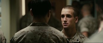 Movie still from “Battle Los Angeles” (2011), directed by Jonathan Liebesman – A man in a military uniform talking to another man in fatigues; Close Up shot, Over the shoulder angle
