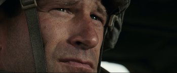 Movie still from “Battle Los Angeles” (2011), directed by Jonathan Liebesman – A person wearing a helmet; Close Up shot, Low angle