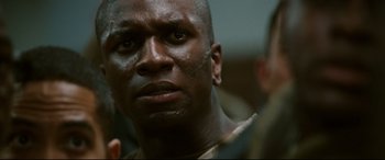 Movie still from “Battle Los Angeles” (2011), directed by Jonathan Liebesman – A man's face in a dark room; Close Up shot, Over the shoulder angle
