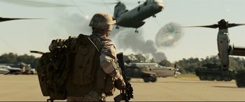 Movie still from “Battle Los Angeles” (2011), directed by Jonathan Liebesman – A soldier is walking away from a helicopter; Wide shot, Low angle