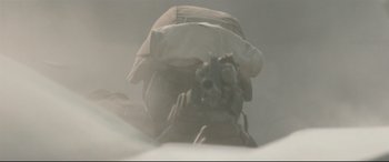 Movie still from “Battle Los Angeles” (2011), directed by Jonathan Liebesman – A person wearing a hat and holding a camera; Extreme Close Up shot, Low angle