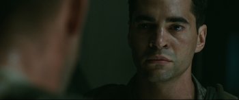 Movie still from “Battle Los Angeles” (2011), directed by Jonathan Liebesman – A person looking at a mirror; Close Up shot, Over the shoulder angle