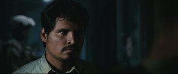 Movie still from “Battle Los Angeles” (2011), directed by Jonathan Liebesman – A person wearing a shirt; Close Up shot, Over the shoulder angle