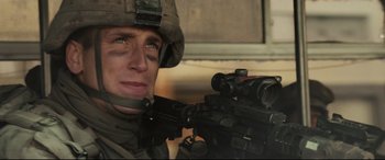 Movie still from “Battle Los Angeles” (2011), directed by Jonathan Liebesman – A man in a military uniform holding a rifle; Close Up shot, Low angle