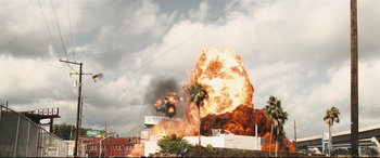 Movie still from “Battle Los Angeles” (2011), directed by Jonathan Liebesman – An explosion is seen in the sky above a building; Extreme Wide shot, Low angle