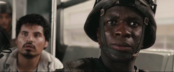 Movie still from “Battle Los Angeles” (2011), directed by Jonathan Liebesman – A person wearing a helmet; Close Up shot, Low angle