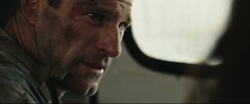 Movie still from “Battle Los Angeles” (2011), directed by Jonathan Liebesman – A man's face in a vehicle; Close Up shot, Over the shoulder angle