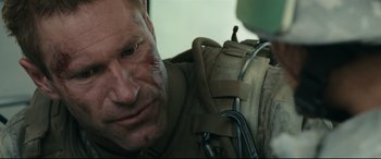 Movie still from “Battle Los Angeles” (2011), directed by Jonathan Liebesman – A person with a bandage on his face; Close Up shot, Over the shoulder angle