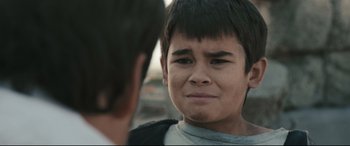 Movie still from “Battle Los Angeles” (2011), directed by Jonathan Liebesman – A young boy is looking at another young man; Close Up shot, Over the shoulder angle