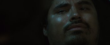 Movie still from “Battle Los Angeles” (2011), directed by Jonathan Liebesman – A man's face in the dark; Extreme Close Up shot, Low angle