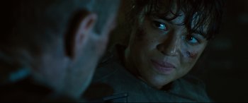 Movie still from “Battle Los Angeles” (2011), directed by Jonathan Liebesman – A man and a woman looking at each other in the dark; Close Up shot, Over the shoulder angle